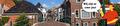 Brug over water met huizen en winkels er omheenet 