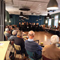 Gemengd koor Usquert zingt de mantelzorgers een warm welkom toe!